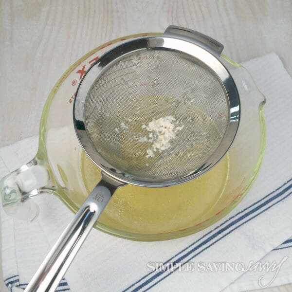 pour chicken broth through sieve