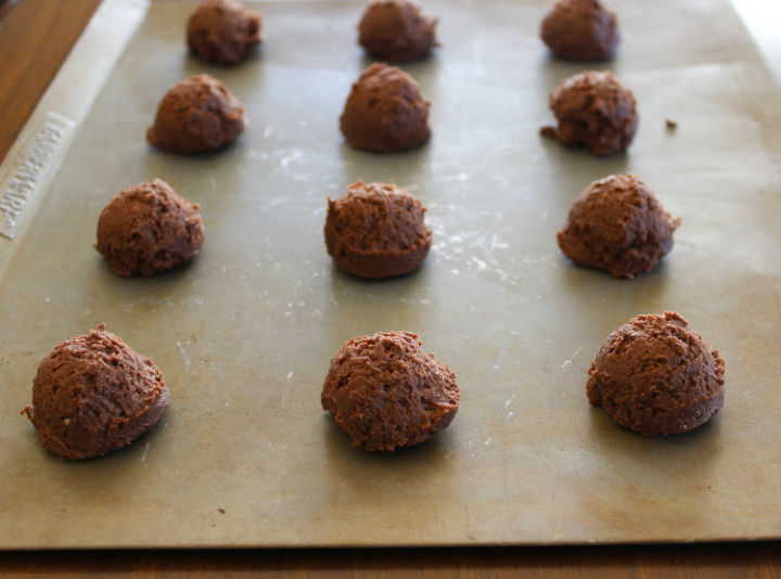 chocolate cookie dough balls on baking sheet