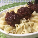 bbq meatballs served over egg noodles